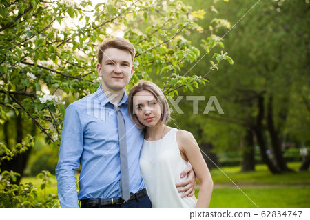 Happy boy and girl in park, outdoors portrait 62834747