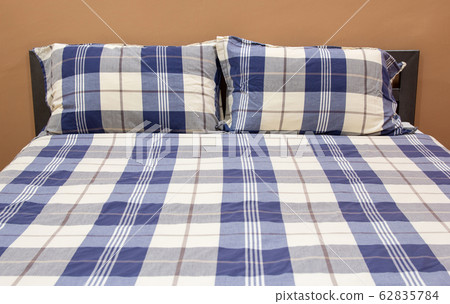 Plaid Bed with Pillow in The Bedroom Interior Plaid Bed with Pillow in The Bedroom Interior 62835784