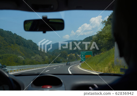 Driving on a highway 62836942