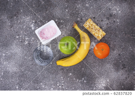 Apple, yogurt, banana and granola bar Apple, yogurt, banana and granola bar 62837820
