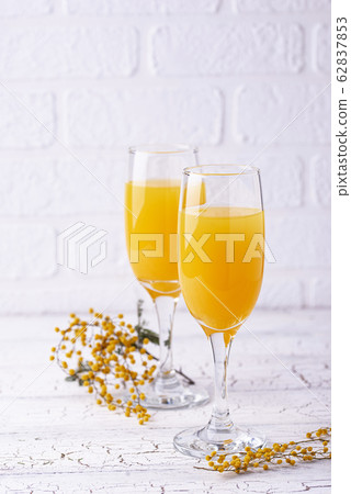 Mimosa cocktail with orange juice 62837853
