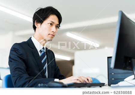 Young businessman (office, computer, suit, desk work Young businessman (office, computer, suit, desk work 62838088