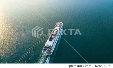 Aerial view Cruise ship at sunset in ocean, Aerial Aerial view Cruise ship at sunset in ocean, Aerial 62839296