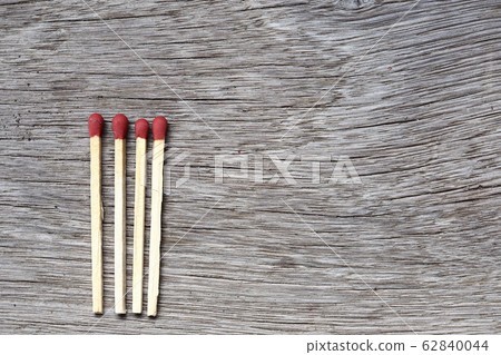 four pile of fire match arrange in a row on a wood four pile of fire match arrange in a row on a wood 62840044