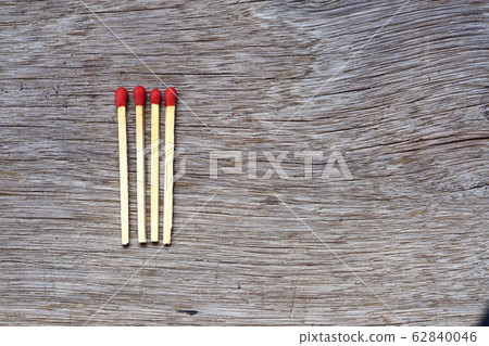 four pile of fire match arrange in a row on a wood four pile of fire match arrange in a row on a wood 62840046