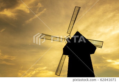 silhouette sunset low angle of wood windmill, 62841071