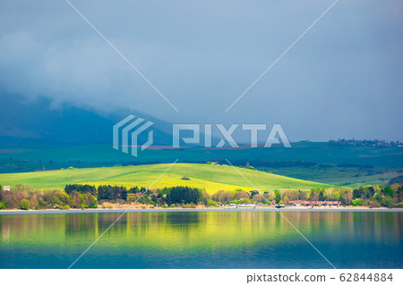 lake in mountains. cloudy day in springtime lake in mountains. cloudy day in springtime 62844884