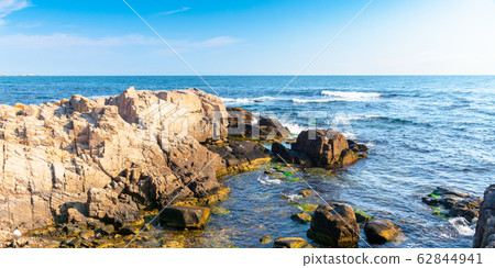 rocky sea coast in the morning rocky sea coast in the morning 62844941