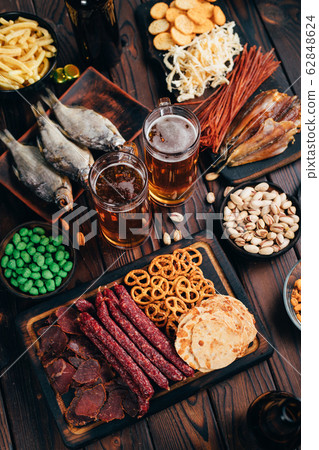 Set of appetizers, salty snacks and light beer 62848624