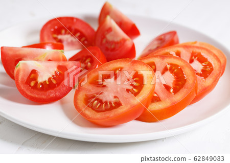 fresh tomatoes on white wooden background fresh tomatoes on white wooden background 62849083