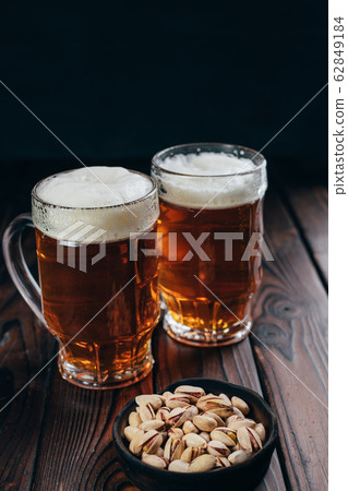 beer and snacks. craft lager and pistachios beer and snacks. craft lager and pistachios 62849184