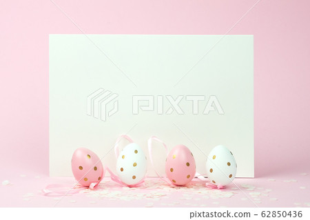 Easter eggs in polka dot , pink and white colour, blank paper for your text or design. 62850436