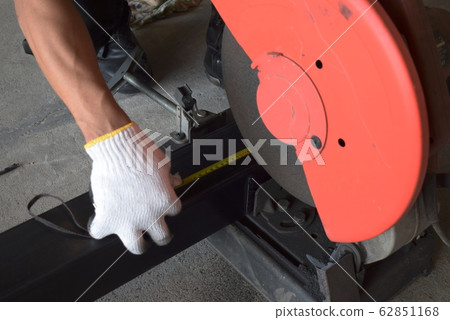 Men use length measuring tools to cut steel  62851168