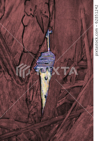 Abstract figures or character on a wooden board 62851242