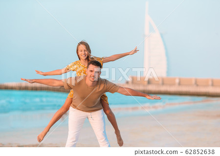 Beautiful father and daughter at the beach enjoying summer vacation. 62852638