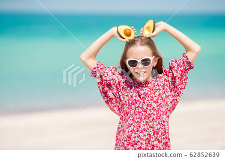 Cute little girl at beach during summer vacation 62852639