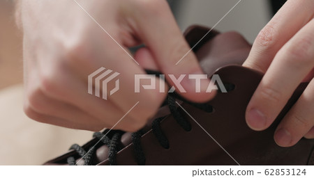 remove laces from sneakers before maintenance 62853124