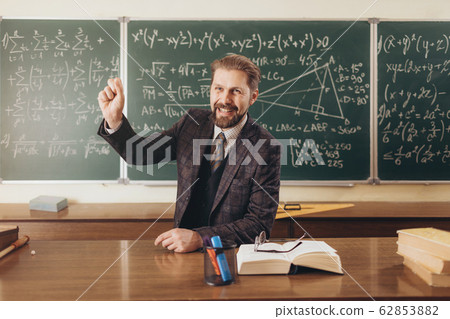 Smiling Math Teacher Encouraging the Audience During Lecture 62853882