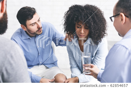 Rehab Community Members Supporting Upset Afro Woman At Therapy Session 62854657
