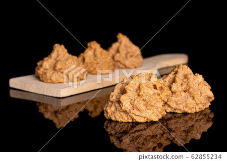 Coconut chocolate biscuit isolated on black glass Coconut chocolate biscuit isolated on black glass 62855234