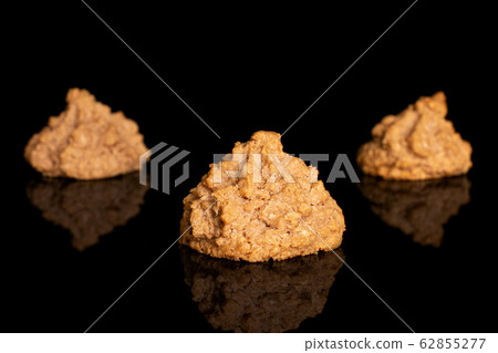Coconut chocolate biscuit isolated on black glass Coconut chocolate biscuit isolated on black glass 62855277