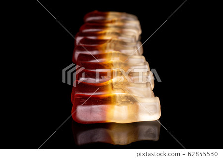 Sweet jelly cola isolated on black glass Sweet jelly cola isolated on black glass 62855530