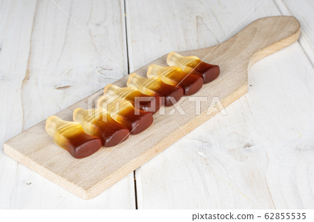Sweet jelly cola on grey wood Sweet jelly cola on grey wood 62855535