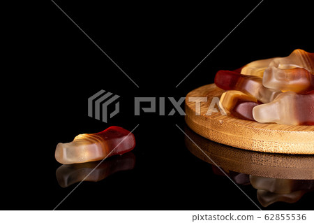 Sweet jelly cola isolated on black glass Sweet jelly cola isolated on black glass 62855536