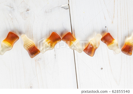 Sweet jelly cola on grey wood Sweet jelly cola on grey wood 62855540