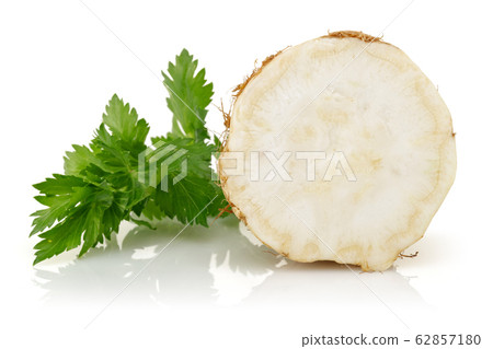 Fresh half celeriac with leaves isolated on white 62857180