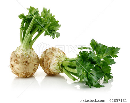 Fresh celeriac with leaves isolated Fresh celeriac with leaves isolated 62857181