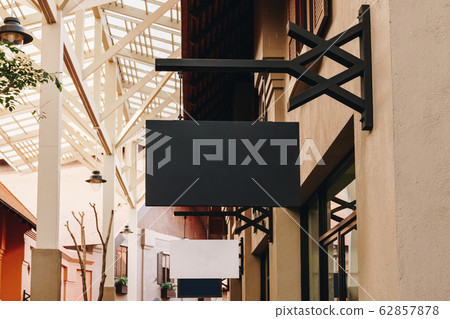 horizontal black empty signage on clothes shop 62857878