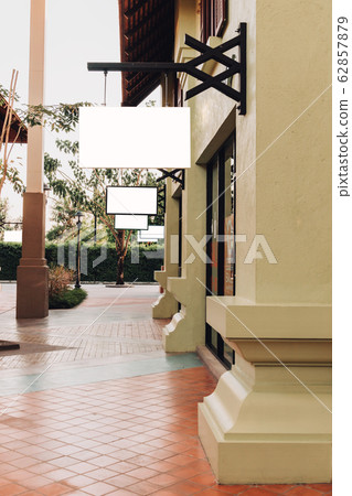 horizontal empty signage on clothes shop front 62857879