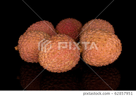 Fresh lychee fruit isolated on black glass Fresh lychee fruit isolated on black glass 62857951