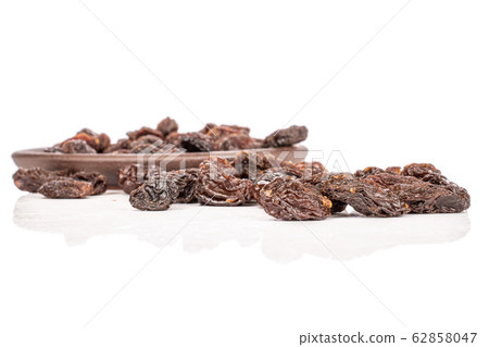 Dried dark raisin isolated on white Dried dark raisin isolated on white 62858047