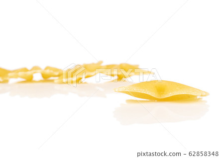 Yellow farfalle pasta isolated on white 62858348
