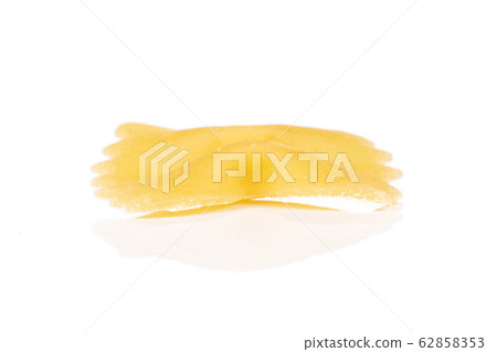 Yellow farfalle pasta isolated on white Yellow farfalle pasta isolated on white 62858353