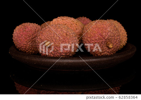 Fresh lychee fruit isolated on black glass 62858364