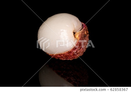 Fresh lychee fruit isolated on black glass Fresh lychee fruit isolated on black glass 62858367
