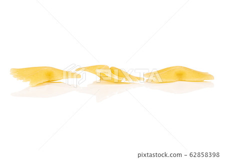 Yellow farfalle pasta isolated on white Yellow farfalle pasta isolated on white 62858398