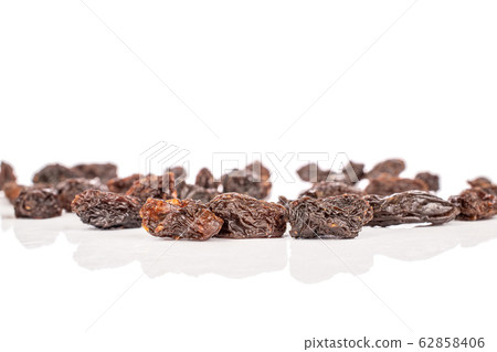 Dried dark raisin isolated on white Dried dark raisin isolated on white 62858406