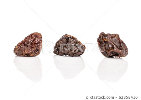 Dried dark raisin isolated on white Dried dark raisin isolated on white 62858410