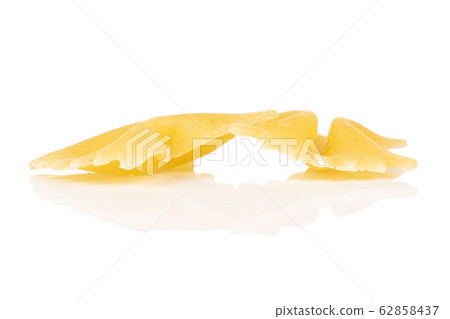 Yellow farfalle pasta isolated on white Yellow farfalle pasta isolated on white 62858437