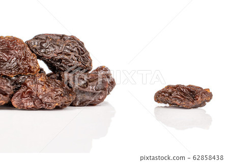 Dried dark raisin isolated on white Dried dark raisin isolated on white 62858438