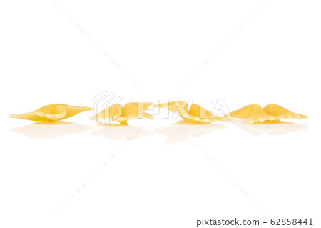 Yellow farfalle pasta isolated on white Yellow farfalle pasta isolated on white 62858441
