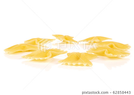 Yellow farfalle pasta isolated on white Yellow farfalle pasta isolated on white 62858443