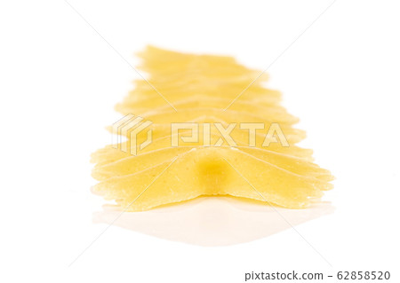 Yellow farfalle pasta isolated on white Yellow farfalle pasta isolated on white 62858520