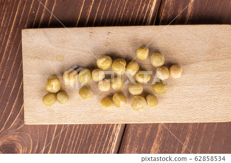 Canned pea on brown wood Canned pea on brown wood 62858534