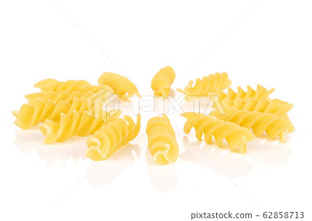 Yellow fusilli pasta isolated on white Yellow fusilli pasta isolated on white 62858713