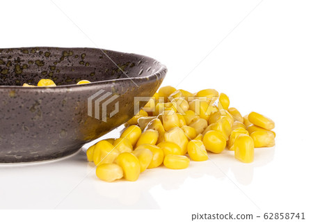 Yellow canned corn isolated on white Yellow canned corn isolated on white 62858741